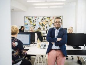Man sitting on a desk at office
