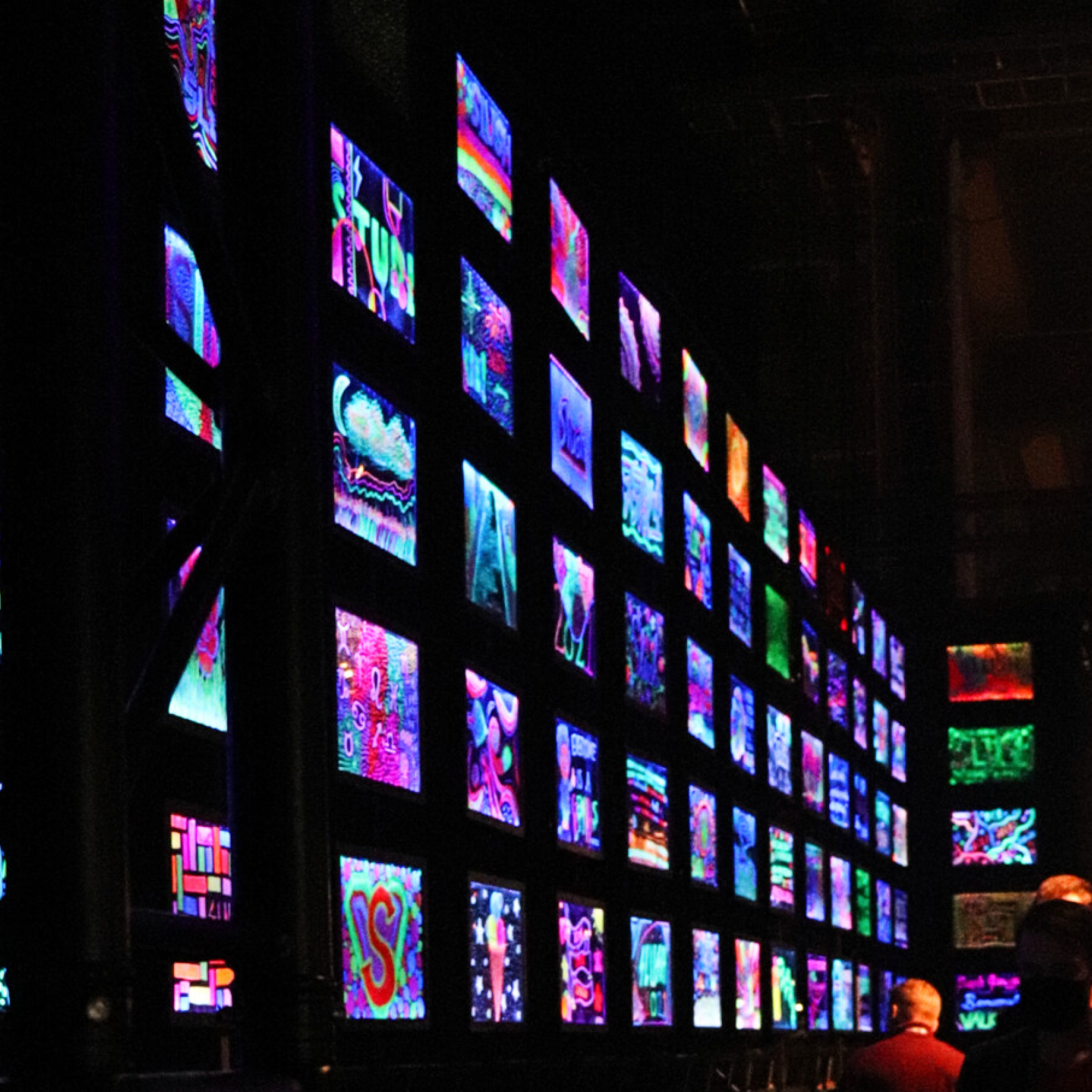 Wall of small screens featuring various line and colours at Slush 2023